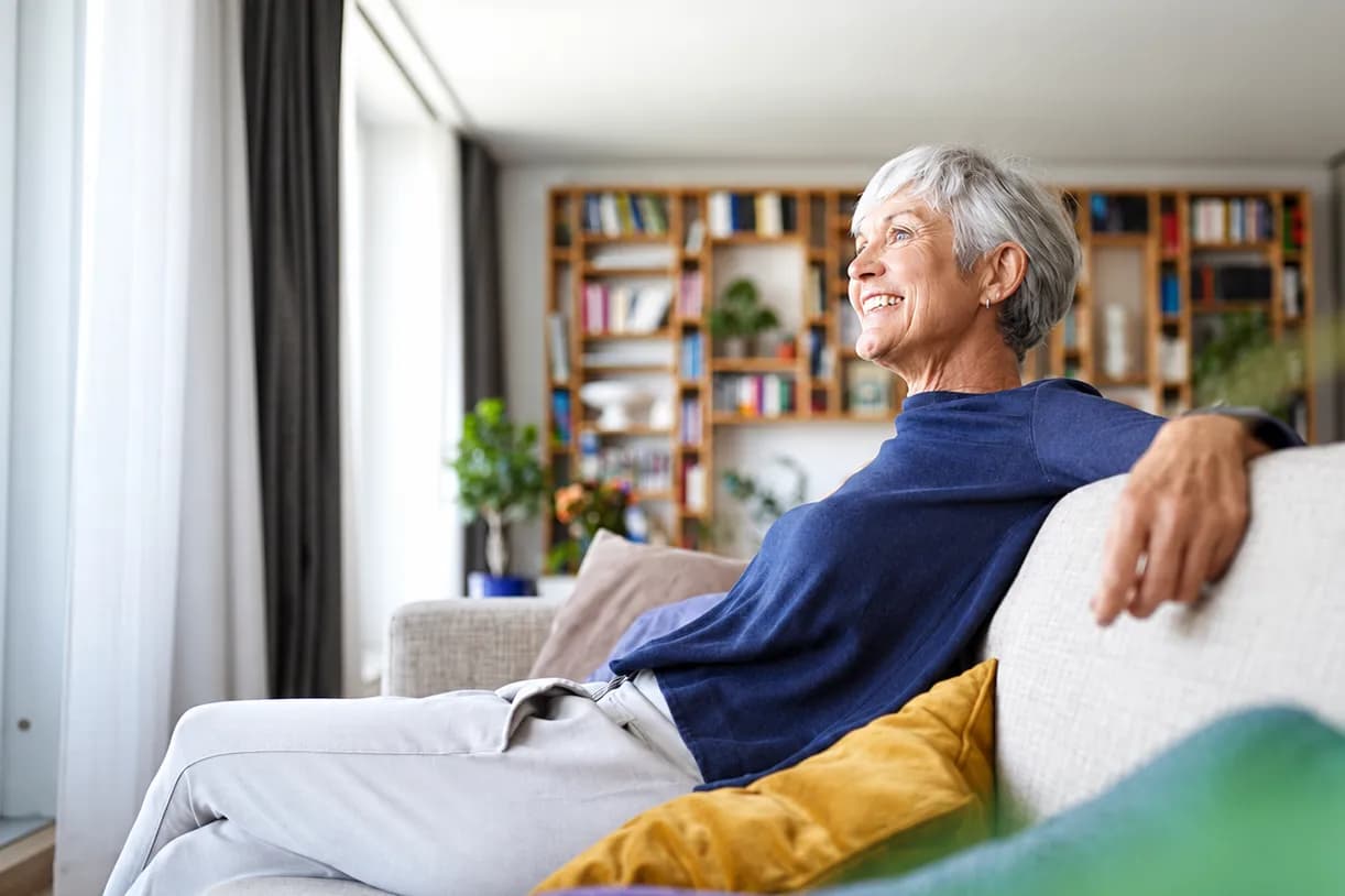 Smiling senior woman relaxing at home