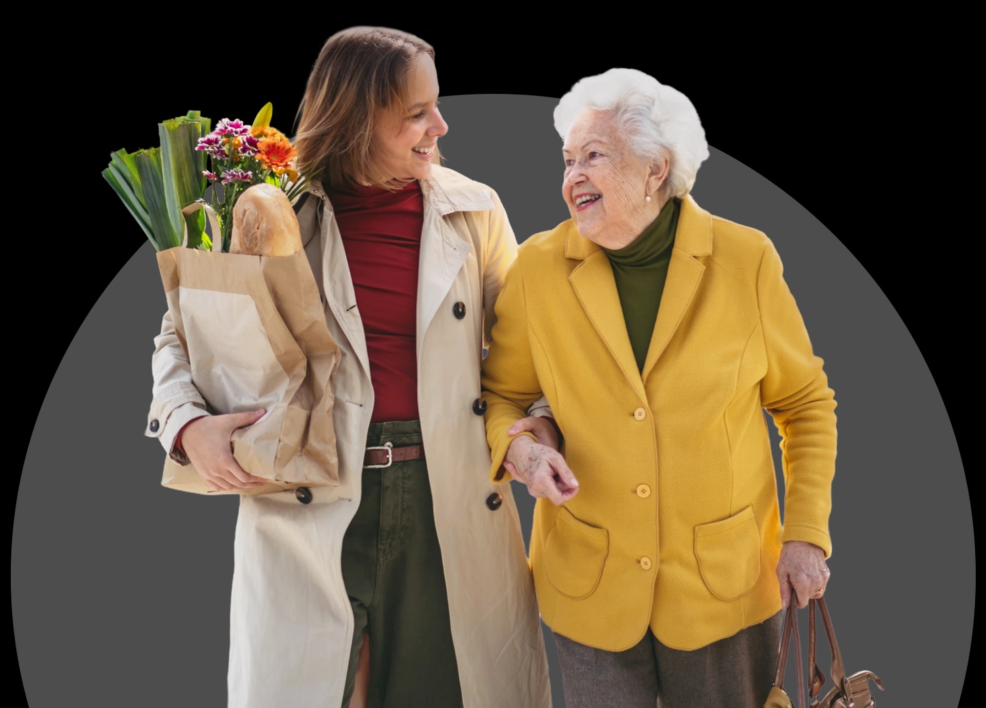 A carer walking arm in arm with an older woman